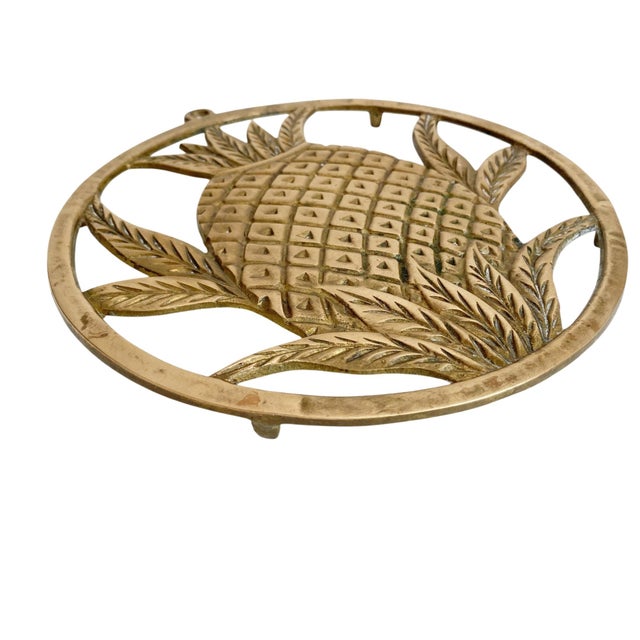 Elevate your kitchen decor with the Brass Circular Pineapple Trivet, a stunning blend of functionality and style. Crafted...