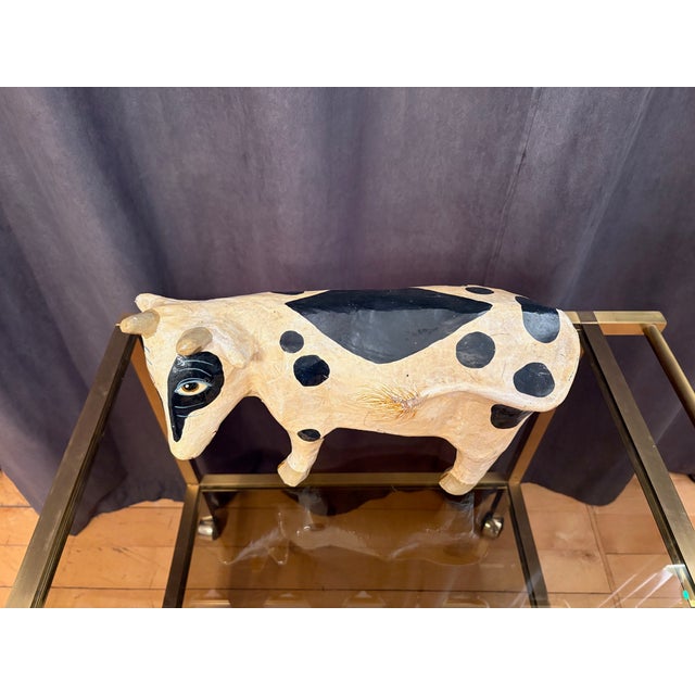 A paper mache cow figure from the 1970s. In original and good condition. Superficial abrasions and small cracks on the...