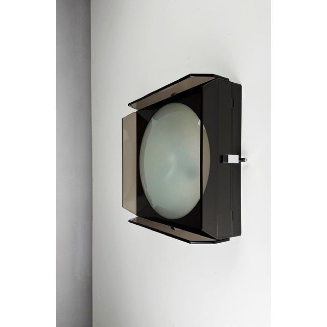 Smoked Glass Wall Lamp by Veca, 1970s, in Good conditions. Designed 1970 to 1979 This piece has an attribution mark, I am...