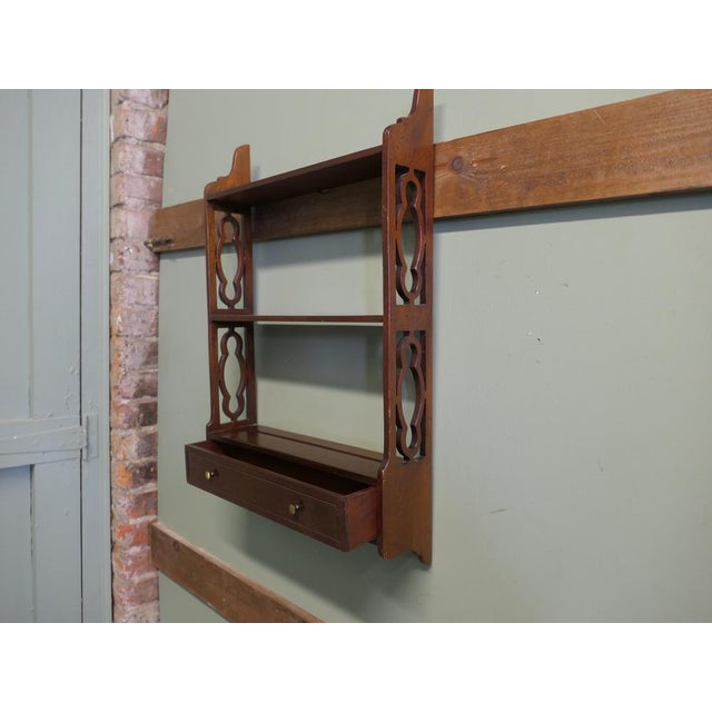 Pretty Wall Hanging Shelves with a Drawer This is a charming little shelf unit, the shelf has open carved sides and a long...