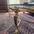 2 Elegant coffee tables with thick glass top with beveled edges. Frame is solid brass with ornate ram head details on...