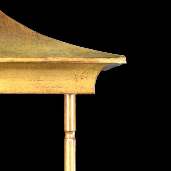 A gilded faux bamboo pagoda etagere — tiered shelves framed by playful pagoda tops and classic bamboo-turned posts. It...