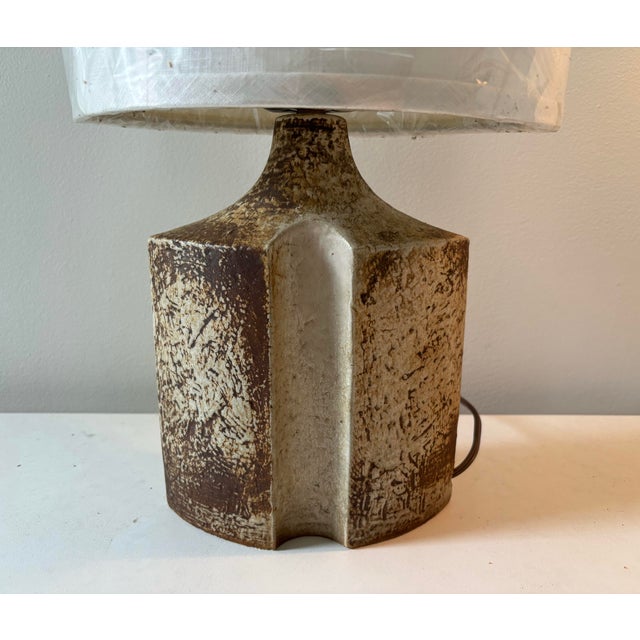 A striking table lamp designed by Haico Nietzsche in the 1960s and produced as model 1219-1 by Søholm Stentøj. Both...