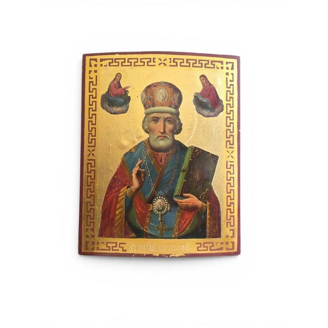 Authentic 19th-century religious icon depicting Saint Nicholas, hand-painted on a wooden panel and enriched with gilded...