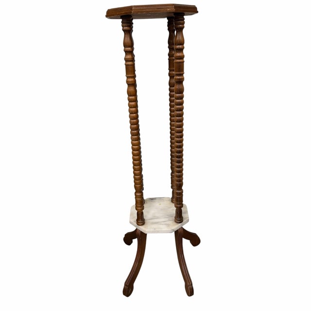 Vintage two tier marble with turned spool legs plant stand or pedestal. Will hold a base or container up to 10.5”...