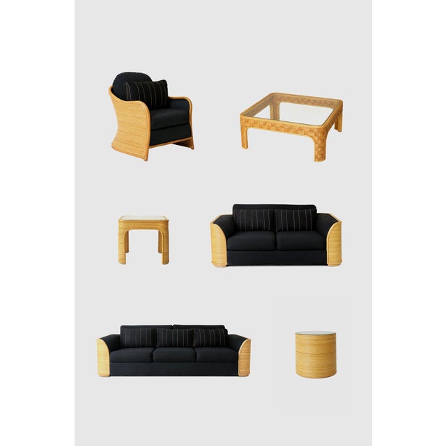 A sculptural coffee table crafted from woven rattan, defined by its softly rounded corners and architectural open base....