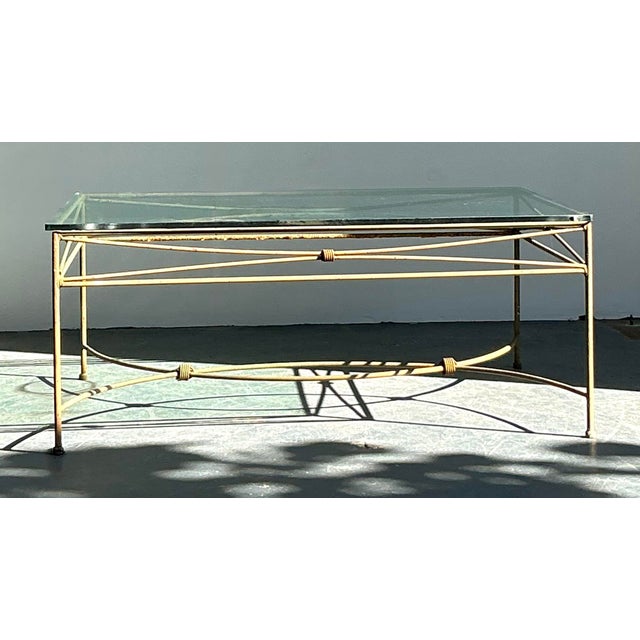 Anchor your living space or sunroom with the rugged elegance of this vintage wrought iron coffee table. The piece features...