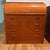 Elegant Danish secretary desk crafted in teak, featuring a roll-top design with a sleek, streamlined silhouette. Lockable...