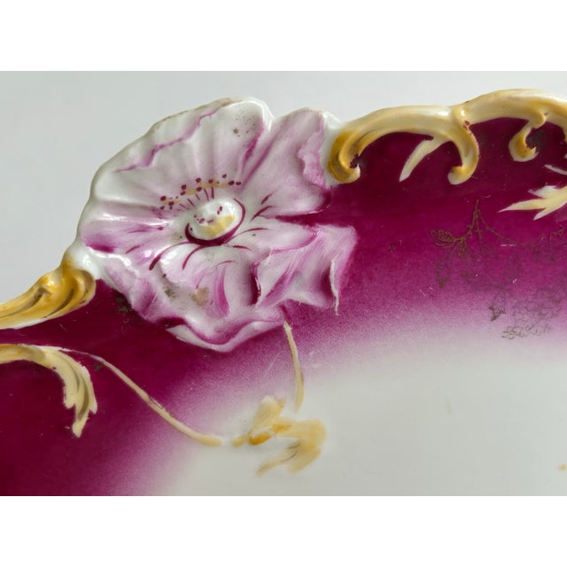 A striking antique Weimar porcelain tray, dating to the late 19th or early 20th century, featuring an elegant raspberry-...