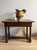 An 18th-century French walnut bobbin table, rich with the kind of patina only centuries of use can produce. The softly...