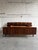 Exceptional vintage Danish modern bed frame crafted in stunning rosewood with dramatic bookmatched grain throughout. This...