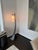 A striking Hubbardton Forge floor lamp showcasing the brand’s signature blend of sculptural metalwork and warm,...