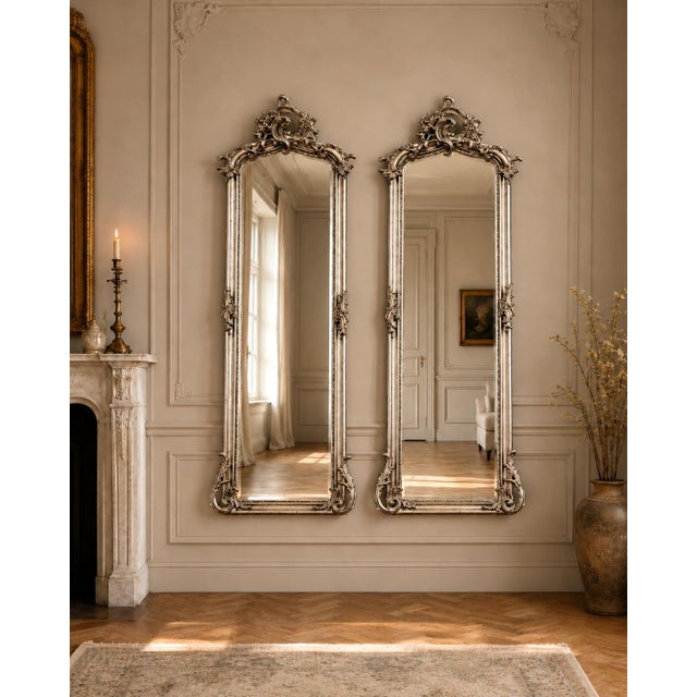 This striking pair of late 20th-century floor mirrors combines impressive scale with the decorative elegance of the Rococo...