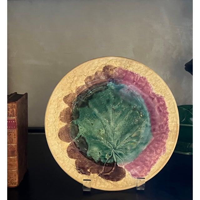 Etruscan Majolica wall plate made by Griffin, Smith & Hill in the 1880's. The plate has a yellow basketweave background...