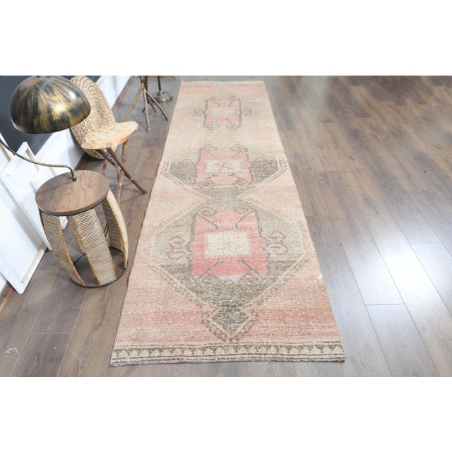 Vintage Turkish Hand-Knotted vintage rug is a semi- vintage runner rug.'70s Eastern region of Turkey's unique rug is...