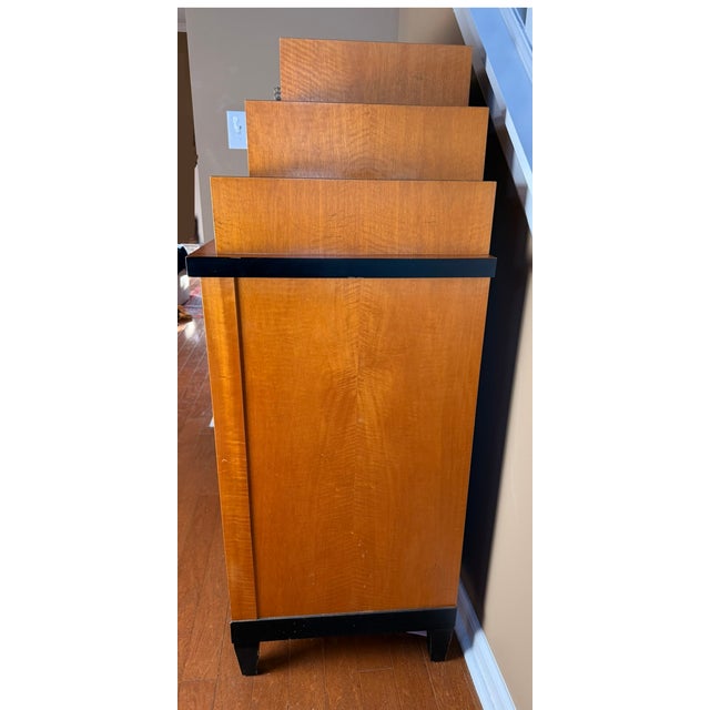 A beautifully crafted Baker Furniture chest in the timeless Biedermeier style, featuring rich burl wood veneer and...