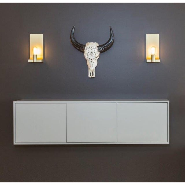 Wall light in messing plate construction, for one caret squirrel cage lamp. For indoor use only (IP20). Caret squirrel...