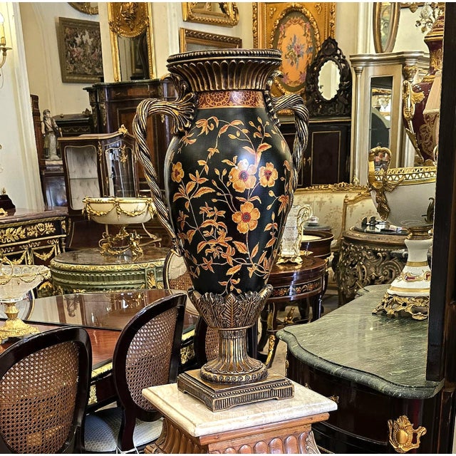 Make a dramatic statement with this striking French-style decorative vase, featuring a deep black porcelain body richly...