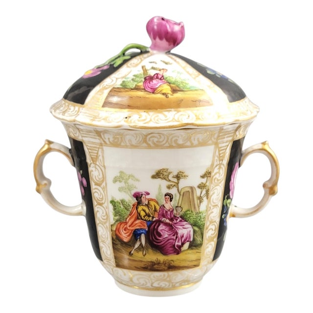 An accomplished example of Dresden revival porcelain, this Helena Wolfsohn chocolate cup trembleuse reflects the refined...
