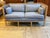 Design Plus Gallery presents a Danish-Style Apartment Sofa. This inviting piece features two seat cushions, two back...