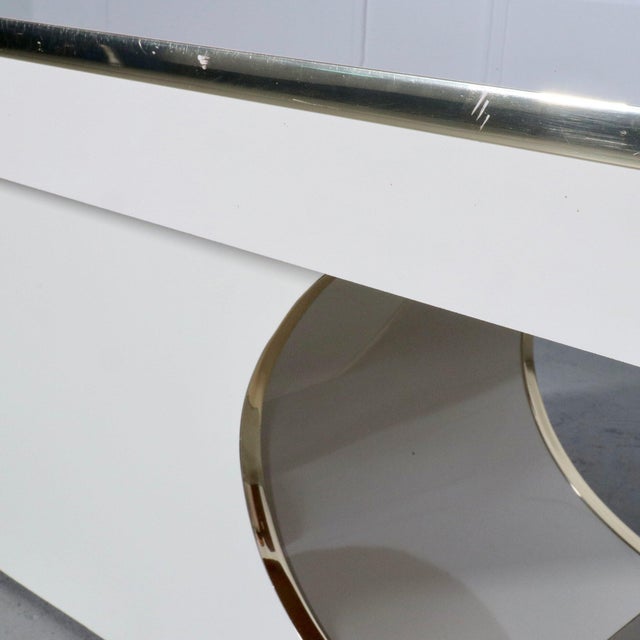 Sculptural brass trimmed laminate coffe table in the manner of Karl Springer Jean-Michel Frank. Circa 1980’s. Clean lines....