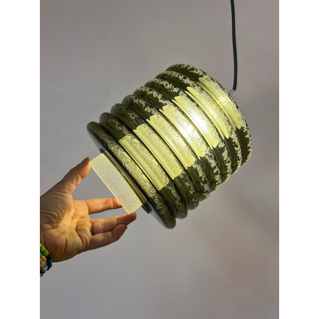 This pendant lamp from the 1970s is a fascinating original from the Space Age and a true work of art for your ceiling. Its...