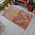 Welcome to our curated collection of authentic Anatolian textiles. This exquisite petite rug embodies the timeless charm...