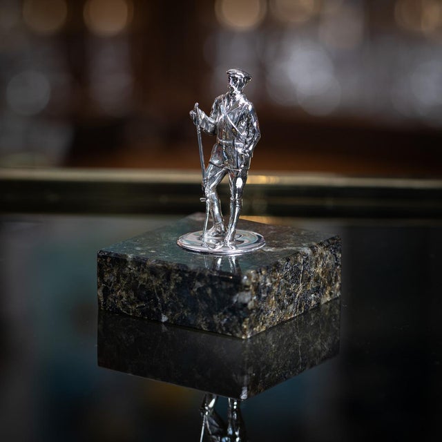 Antique 20th Century Edwardian solid silver statue on a marble base, depicting a fly fisherman raising his rod in a...