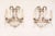 A pair of French Directoire style two-light wall sconces from the 20th century with bronze armature, crystal rosettes and...