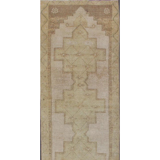 Lightly toned vintage Turkish Runner with Geometric Oushak design, rug , country of origin / type: Turkey / Oushak, circa...