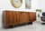An exceptional and rare example of 1960s Hungarian mid-century design. This stunning credenza features a sophisticated,...