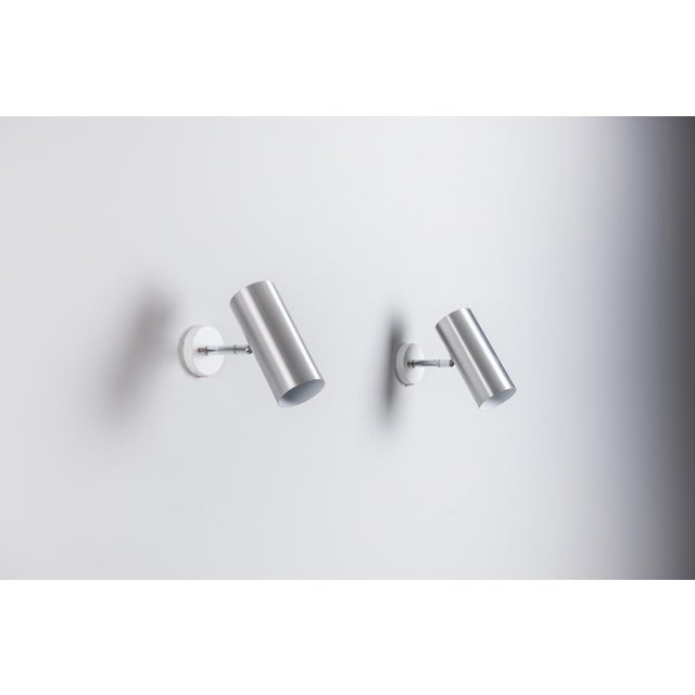 This elegant pair of Raak C1582 adjustable wall lamps combines timeless Dutch design with everyday functionality. In good...
