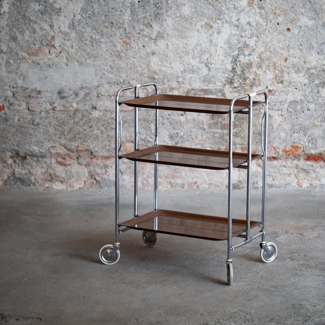A folding food cart. Made in Italy in the 1960s. Rare model with 3 shelves. Excellent condition, with normal signs of use...