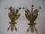 Vintage pair of Federal or Regency style gilt metal wall sconces feature an eagle motif with outstretched wings, holding a...