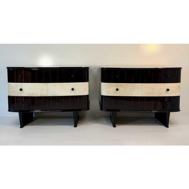A rare and highly decorative pair of matching 1940s dressers, conceived as true twins and defined by a beautifully...