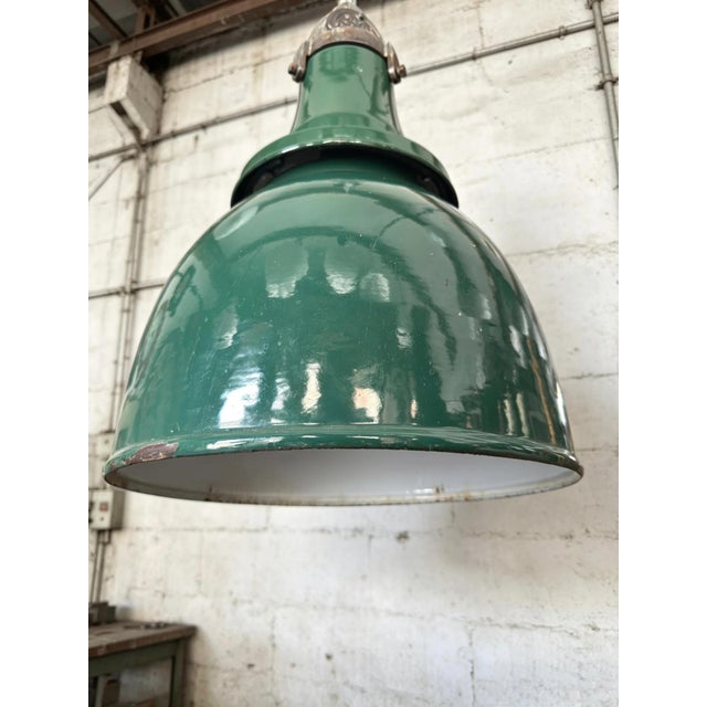 1940s British made large size racing green enamel industrial factory lights by Simplex. These types of lamp shades were...