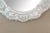 the oval central plate surrounded by a scalloped reverse-etched mirrored border adorned with twisted glass rods and...
