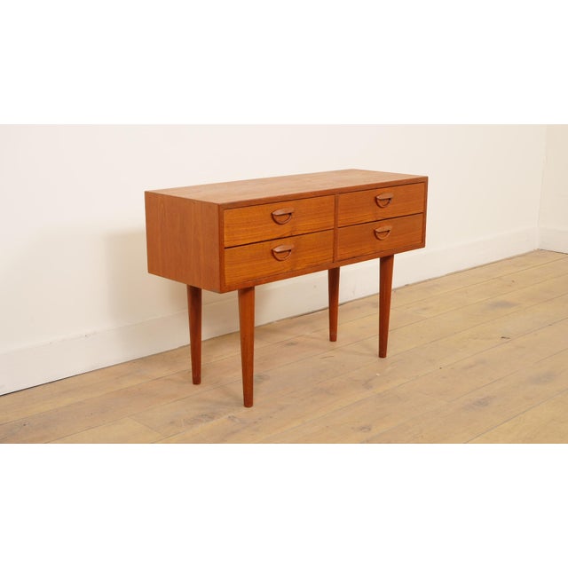 Elegant and compact Danish sideboard/ chest of drawers\. The clean lines and refined handles on the four drawers show...