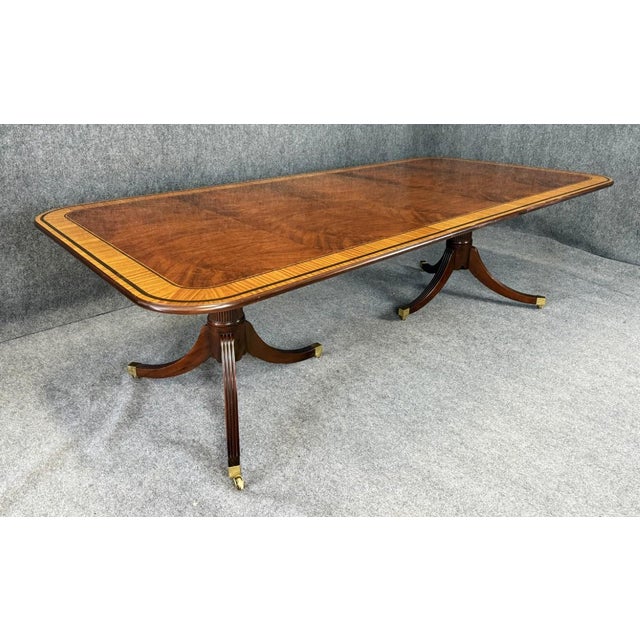 This Georgian-style dining table from the Stately Homes of England and Scotland Collection features a beautifully flamed...