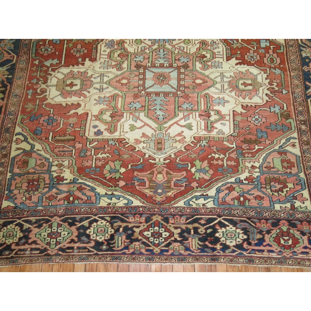 An early 20th-century square shape Persian heriz rug. The medallion is off-centered which looked to be intentionally done...