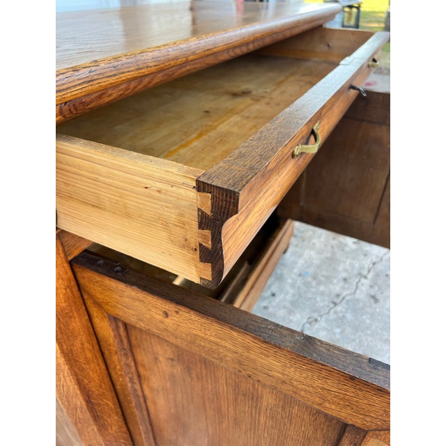 Beautiful French Louis Philippe buffet crafted in warm solid oak, featuring a richly figured natural finish and...