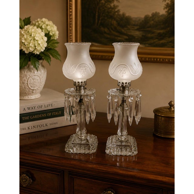 This elegant, fully matching pair of early 20th-century electrified manual luster boudoir accent lamps brings a refined...