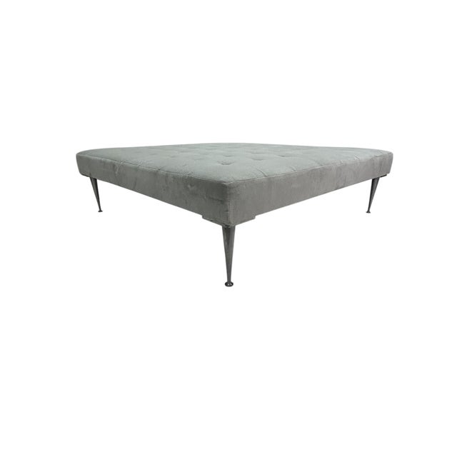 This Oversized Square Tufted Ottoman in Light Grey Velvet with Solid Cast Iron Legs is a magnificent piece and is...