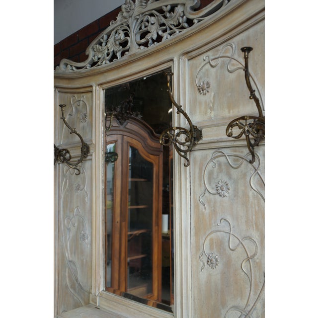 Parisian elegance is reflected in this Art Nouveau hall tree. Notable details of this style such as flowers and curving...
