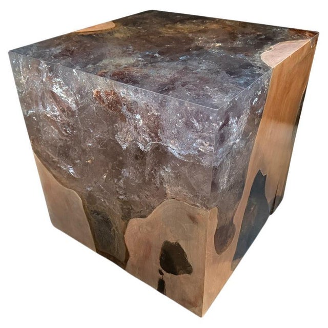 The St. Barts side table is a unique variation of the teak and cracked resin cube. The resin is first cracked and added...