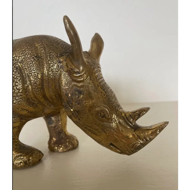 A nice brass rhinoceros in eating/resting/posing mode with lots of detail, perfect for a mantle show piece. Item is in...
