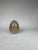 A white, French glass egg with gold hand painted decorative appliqué. Hinged gold metal detailing and perfect for secret...