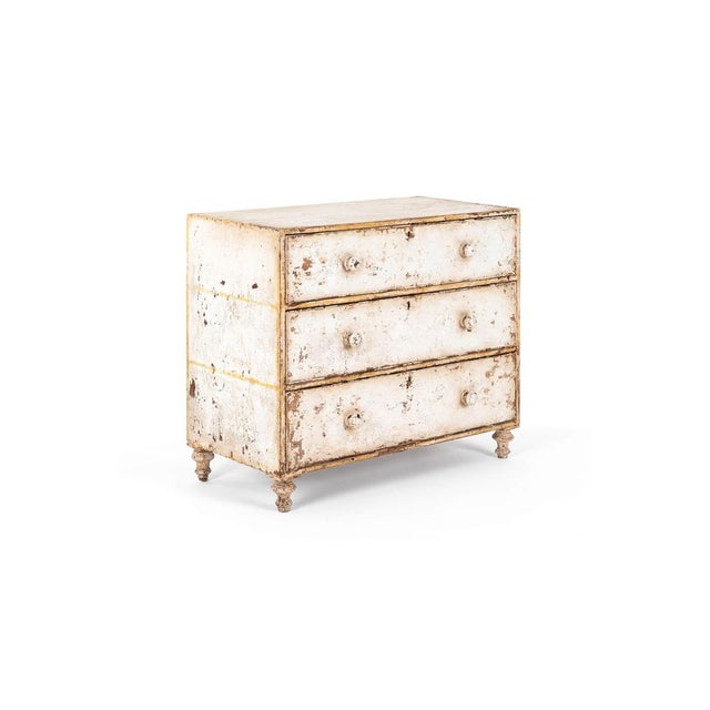 A wonderful 19th-century pine chest in a wonderful distressed white finish. The cabinet features three long graduating...