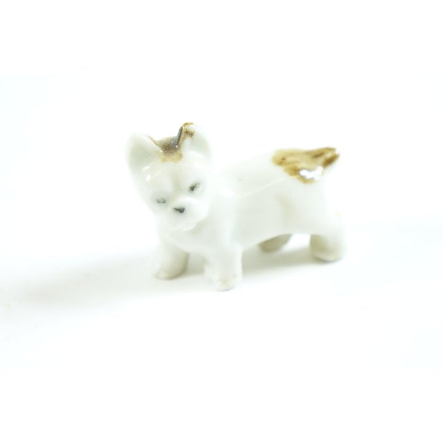 Pair of Porcelain European Dog Figurines - 1.75” x 1.5” This charming pair of porcelain European dog figurines, measuring...