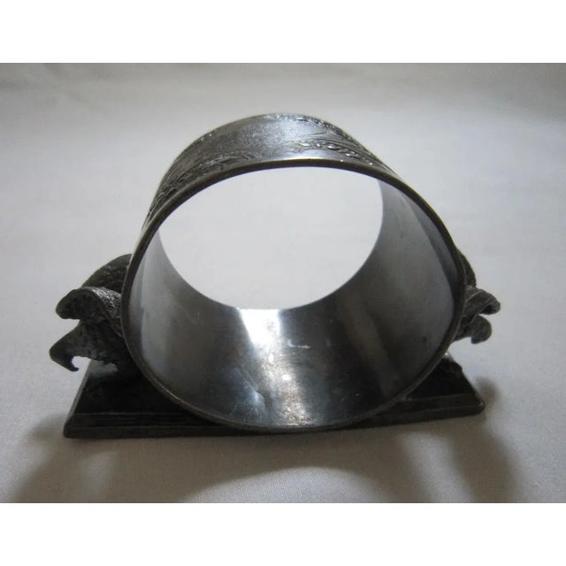 Lovely Antique silver plate napkin ring with eagle detail on either side. Stamped Meriden silverplate on the base. It...